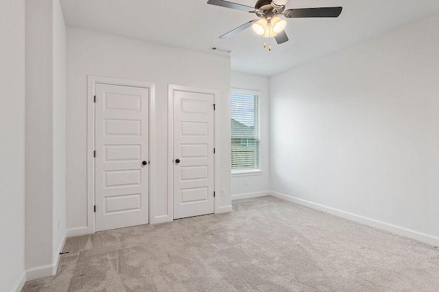 909 Budrio Ave, Tontitown, AR 72762 - unfurnished bedroom with carpet, baseboards, and a ceiling fan