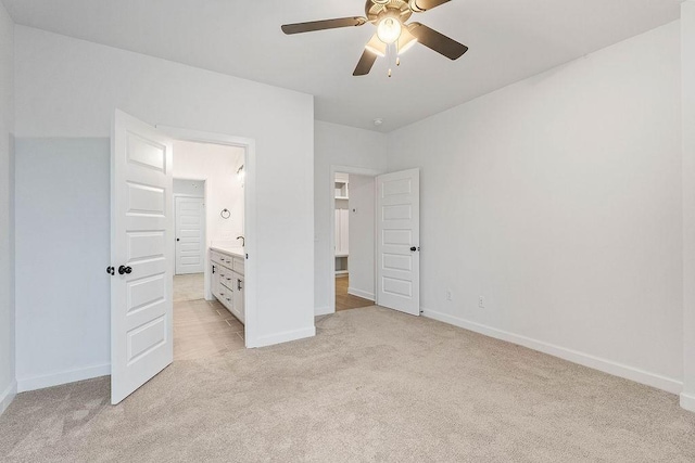 909 Budrio Ave, Tontitown, AR 72762 - unfurnished bedroom featuring light colored carpet, baseboards, and a ceiling fan