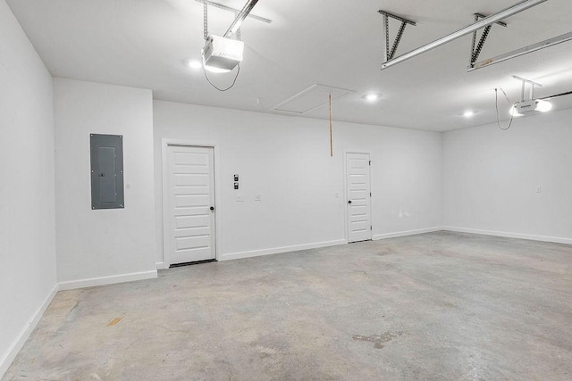 909 Budrio Ave, Tontitown, AR 72762 - garage with electric panel, a garage door opener, and baseboards