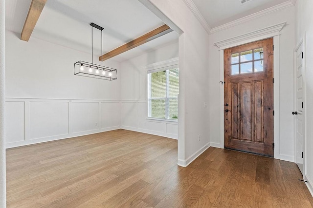 909 Budrio Ave, Tontitown, AR 72762 - entryway with beamed ceiling, wood finished floors, a decorative wall, crown molding, and wainscoting