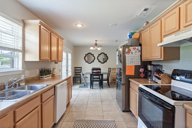 5213 S 62nd St, Rogers, AR 72758 - kitchen featuring range with electric cooktop, a sink, under cabinet range hood, white dishwasher, and a chandelier