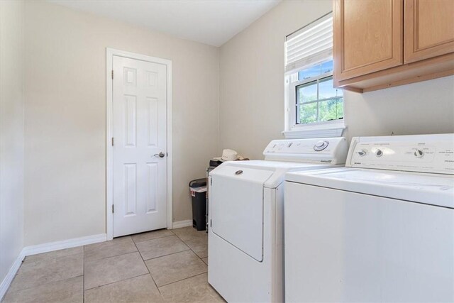 5213 S 62nd St, Rogers, AR 72758 - laundry room with cabinet space, separate washer and dryer, baseboards, and light tile patterned floors