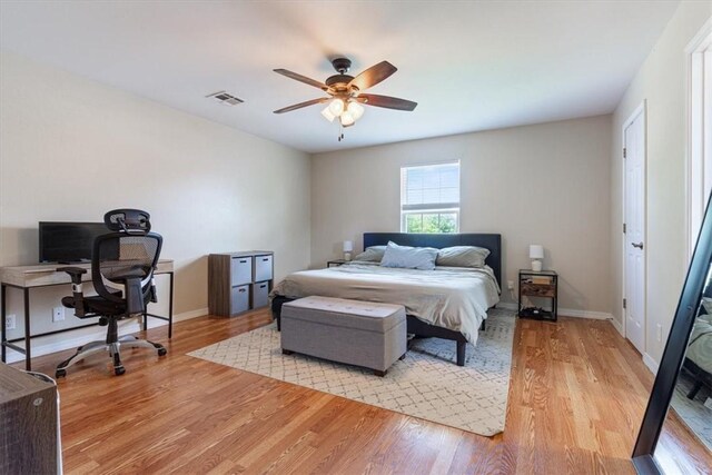 5213 S 62nd St, Rogers, AR 72758 - bedroom featuring light wood-style floors, an office area, baseboards, and ceiling fan