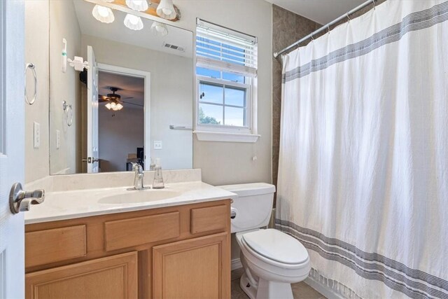 5213 S 62nd St, Rogers, AR 72758 - full bathroom with vanity, toilet, ceiling fan, and a shower with curtain