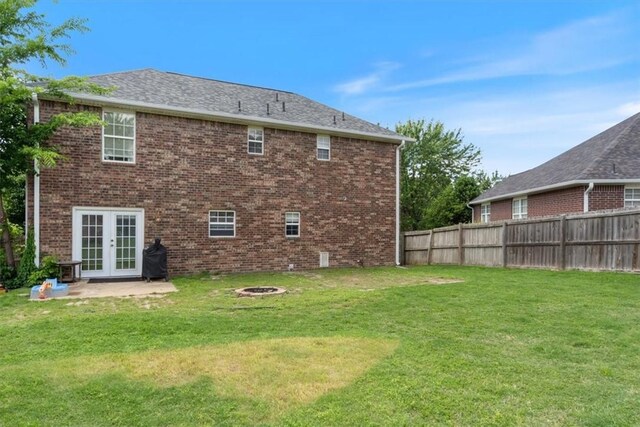 5213 S 62nd St, Rogers, AR 72758 - back of property featuring an outdoor fire pit, french doors, a patio area, and brick siding