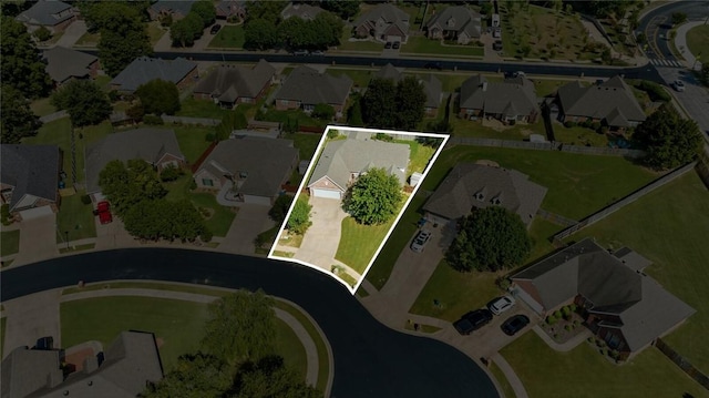 birds eye view of property with a residential view