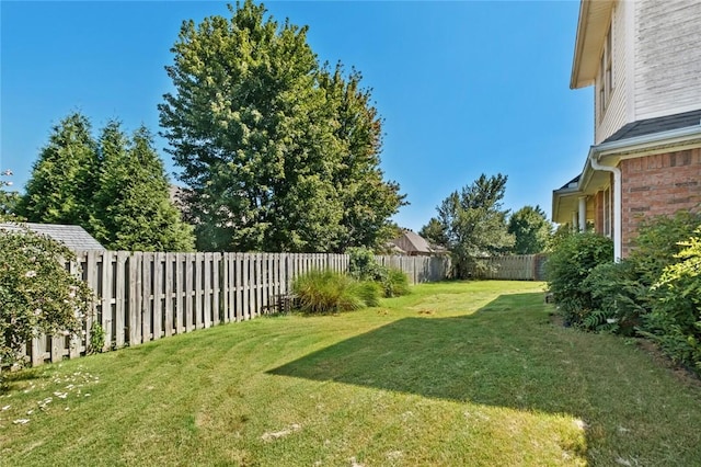 view of yard with a fenced backyard