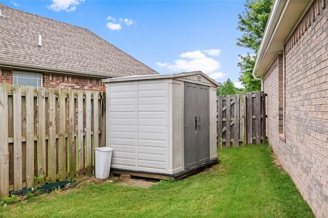 view of shed with a fenced backyard
