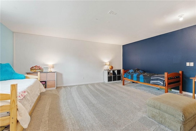 bedroom featuring carpet flooring and baseboards