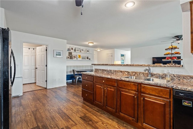 kitchen with refrigerator, ceiling fan, dark wood-style floors, a sink, and dishwasher