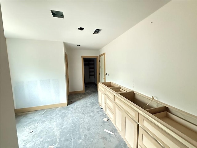 interior space featuring baseboards