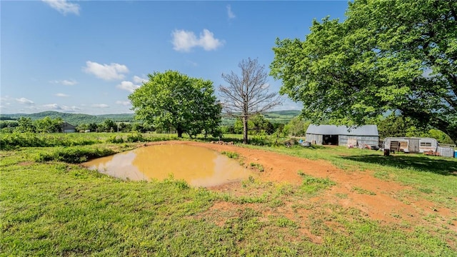 view of property's community with an outdoor structure