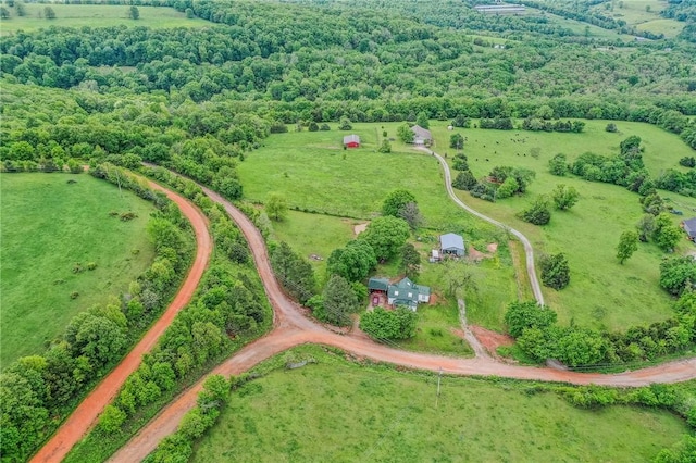 birds eye view of property with a rural view