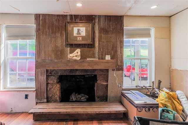 interior space featuring a fireplace and wood finished floors