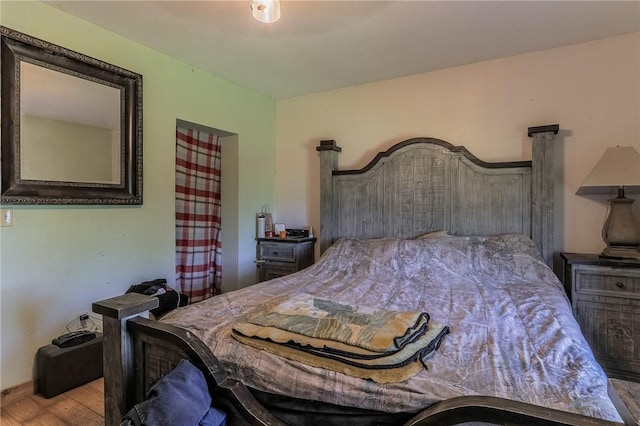 bedroom with wood finished floors