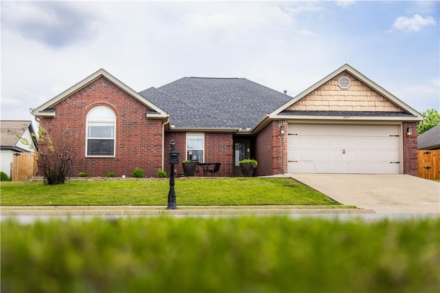 single story home with brick siding, a front lawn, an attached garage, and concrete driveway