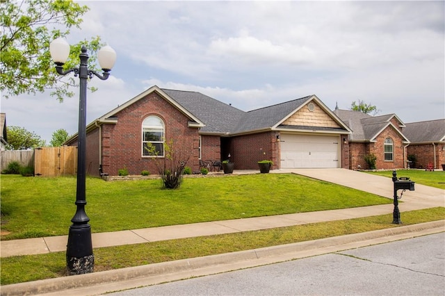ranch-style house with brick siding, an attached garage, and a front yard