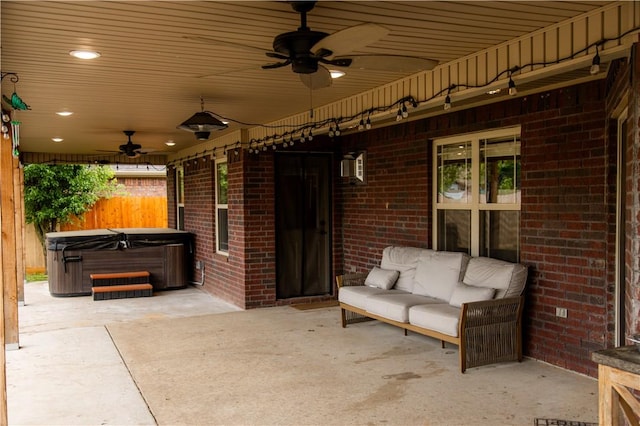 2915 N 15th Pl, Rogers, AR 72756 - view of patio featuring a ceiling fan, a hot tub, and fence
