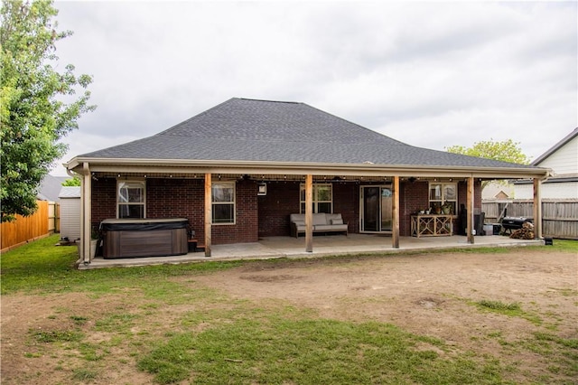 2915 N 15th Pl, Rogers, AR 72756 - back of house with a hot tub, a patio area, brick siding, central air condition unit, and outdoor lounge area