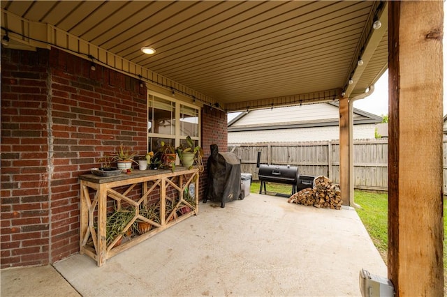 2915 N 15th Pl, Rogers, AR 72756 - view of patio / terrace featuring fence and area for grilling