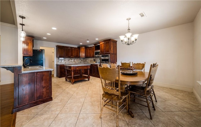 2915 N 15th Pl, Rogers, AR 72756 - dining area with a chandelier, light tile patterned floors, recessed lighting, and baseboards