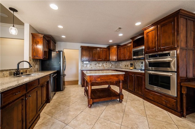 2915 N 15th Pl, Rogers, AR 72756 - kitchen featuring a sink, stainless steel appliances, tasteful backsplash, light stone countertops, and recessed lighting