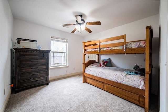 bedroom featuring baseboards, carpet, a ceiling fan, and visible vents