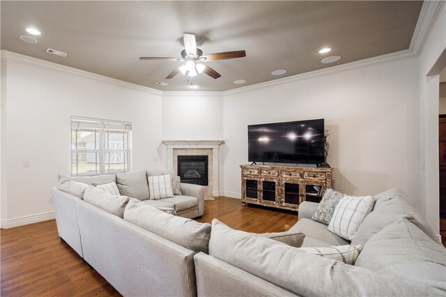 2915 N 15th Pl, Rogers, AR 72756 - living area featuring a ceiling fan, wood finished floors, crown molding, a tile fireplace, and baseboards