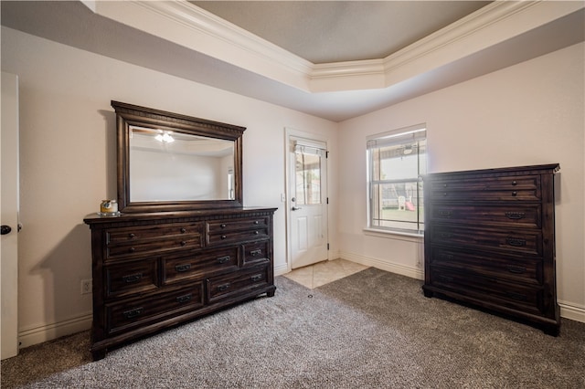 interior space with crown molding, baseboards, and a raised ceiling