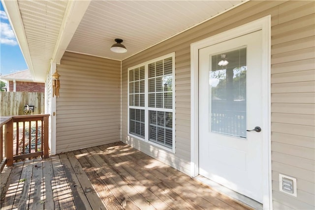 wooden terrace featuring covered porch