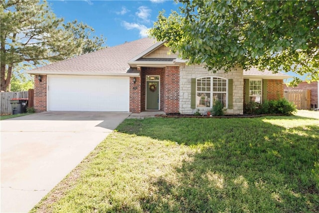 ranch-style home featuring an attached garage, fence, a front yard, and concrete driveway