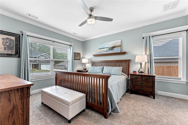 bedroom with baseboards, ornamental molding, carpet flooring, and visible vents