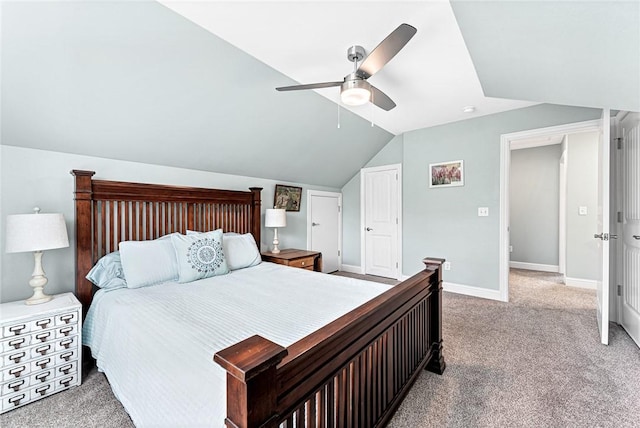 carpeted bedroom with ceiling fan, baseboards, and lofted ceiling