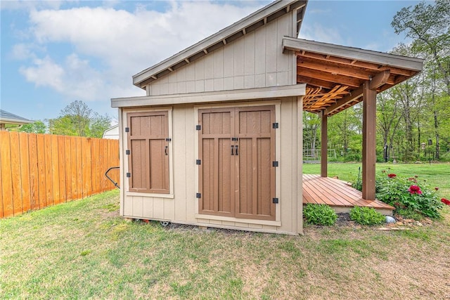 view of shed with a fenced backyard