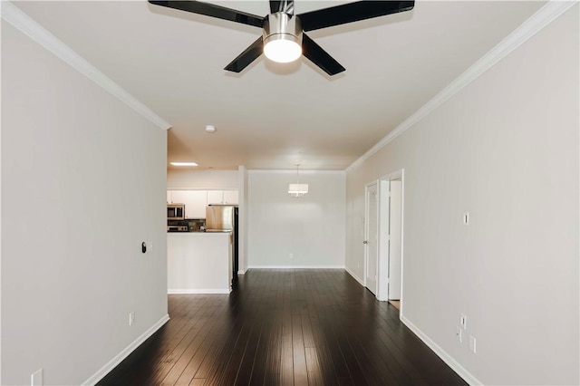 unfurnished living room with ceiling fan, dark wood finished floors, ornamental molding, and baseboards