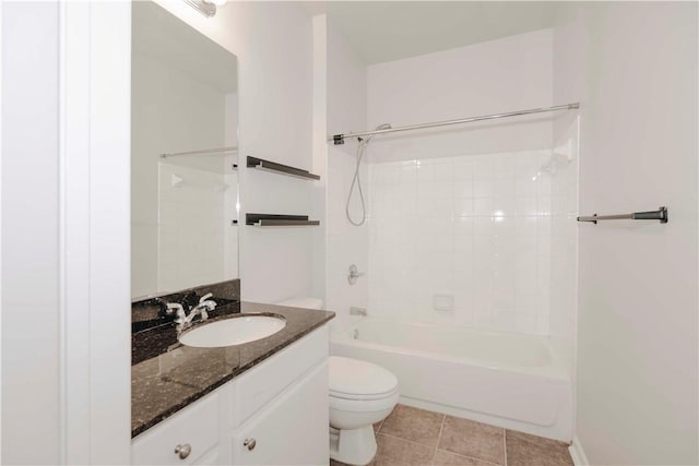 bathroom with vanity, tile patterned flooring, bathtub / shower combination, and toilet