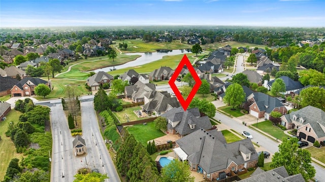 bird's eye view featuring a residential view, view of golf course, and a water view