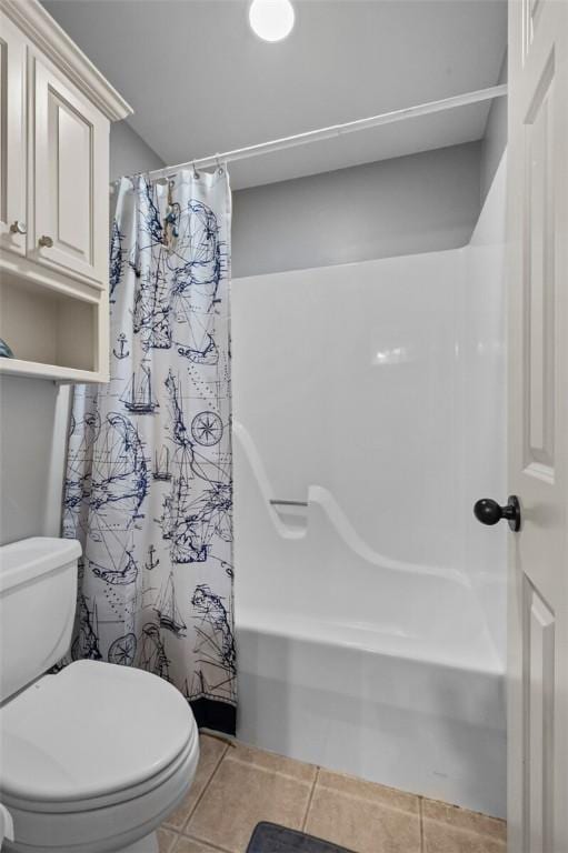 full bathroom featuring tile patterned floors, shower / bath combo, and toilet