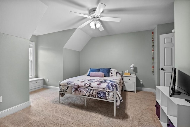 carpeted bedroom featuring baseboards, a ceiling fan, and lofted ceiling