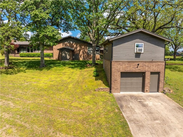 view of front of home with brick siding, an attached garage, a front yard, and concrete driveway