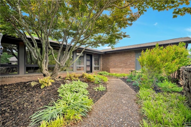view of front of home with brick siding