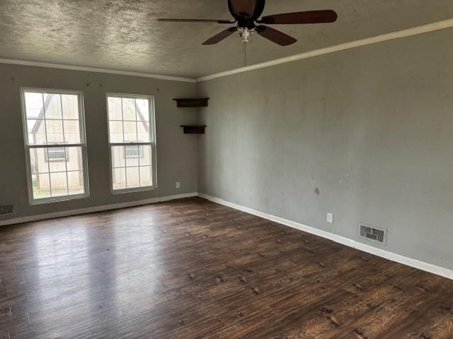 spare room with ceiling fan, ornamental molding, and wood finished floors
