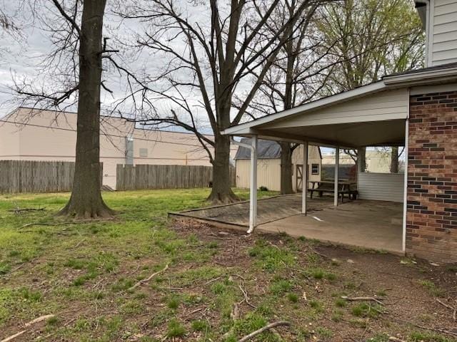 view of yard with fence and a patio area