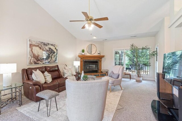 2 Breton Ln, Bella Vista, AR 72715 - living room featuring light colored carpet, lofted ceiling, ceiling fan, and a glass covered fireplace
