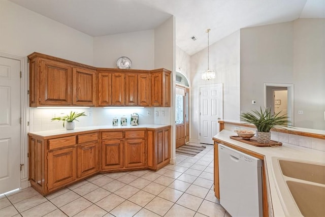 2 Breton Ln, Bella Vista, AR 72715 - kitchen with dishwasher, high vaulted ceiling, light countertops, a sink, and light tile patterned flooring