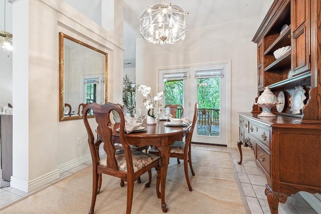 2 Breton Ln, Bella Vista, AR 72715 - dining area with light tile patterned floors, a chandelier, and baseboards