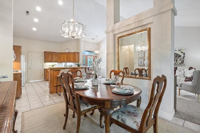 2 Breton Ln, Bella Vista, AR 72715 - dining room featuring a chandelier, vaulted ceiling, light tile patterned floors, baseboards, and recessed lighting