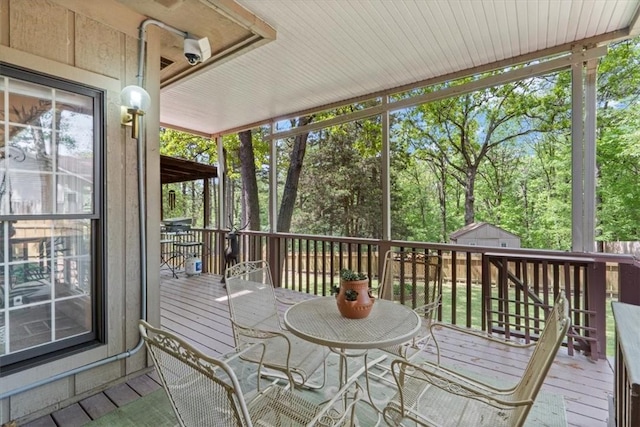 2 Breton Ln, Bella Vista, AR 72715 - sunroom with outdoor dining area and view of wooded area
