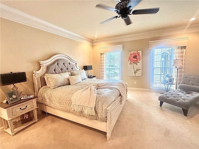 carpeted bedroom with baseboards, ornamental molding, and ceiling fan