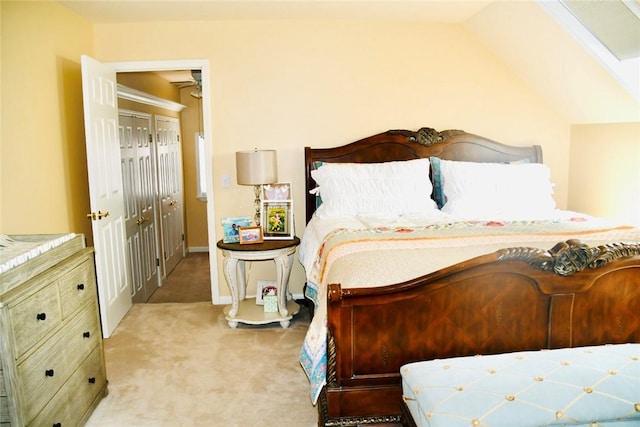bedroom with baseboards, light carpet, and lofted ceiling